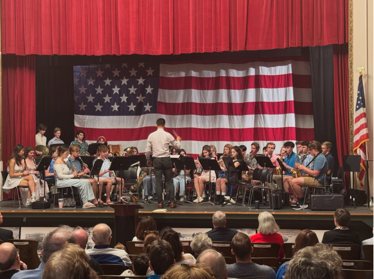 The Hingham High School Band, conducted by Brian Cincotta, plays “God Bless America” during the Memorial Day Ceremony.
